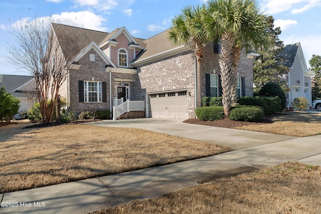 view of front facade with concrete driveway and brick siding