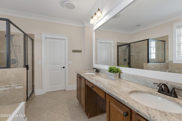 full bath with crown molding, a sink, and a shower stall