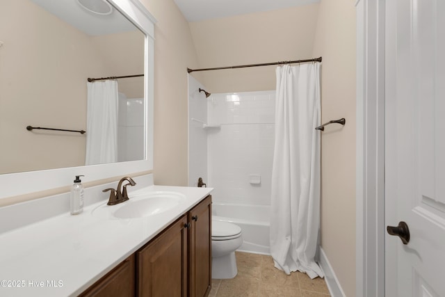 bathroom featuring toilet, tile patterned floors, vanity, and shower / tub combo with curtain