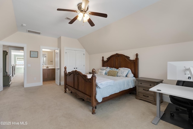 312 Moss Tree Dr, Wilmington, NC 28405 - bedroom featuring visible vents, vaulted ceiling, a closet, and light colored carpet