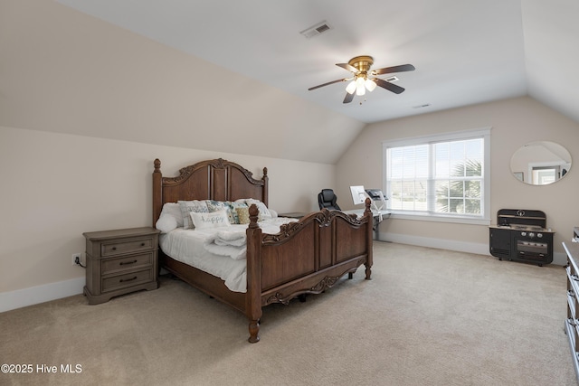 bedroom with baseboards, visible vents, vaulted ceiling, and light colored carpet