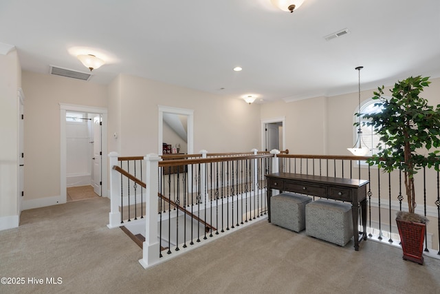312 Moss Tree Dr, Wilmington, NC 28405 - hall featuring baseboards, visible vents, carpet flooring, and an upstairs landing