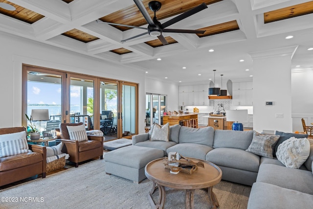 living room with ornamental molding, recessed lighting, beam ceiling, and ceiling fan