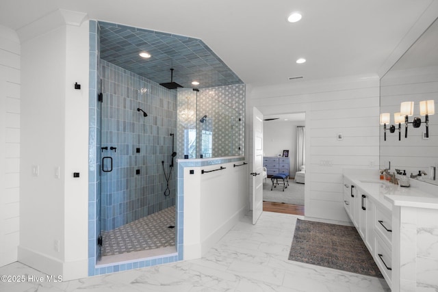 ensuite bathroom with baseboards, ensuite bath, marble finish floor, a shower stall, and recessed lighting