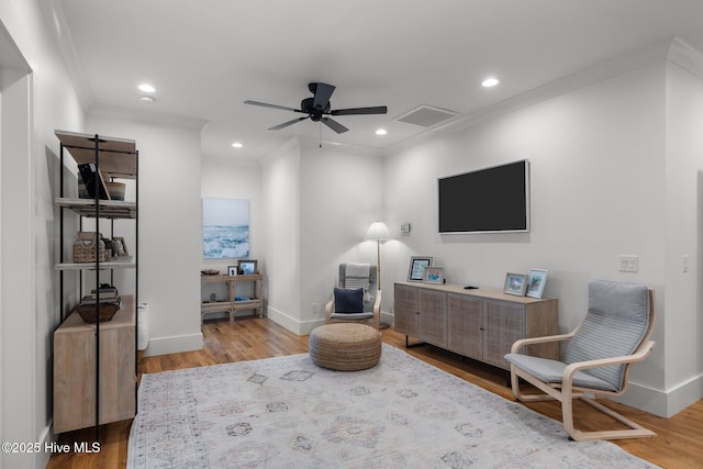 sitting room featuring crown molding, recessed lighting, visible vents, ceiling fan, and wood finished floors