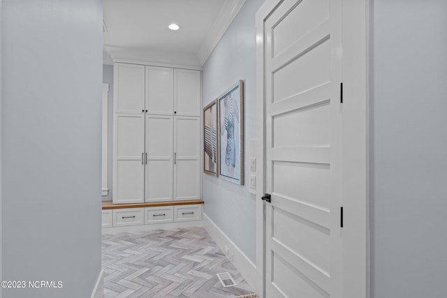 mudroom with crown molding, recessed lighting, and baseboards