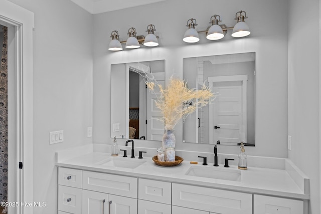 bathroom with double vanity and a sink