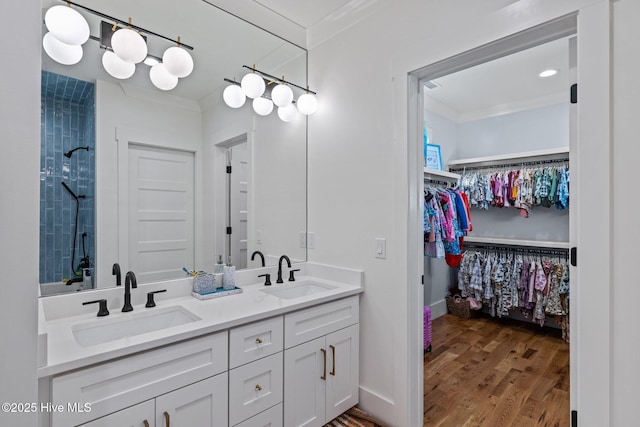 full bath featuring ornamental molding and a sink