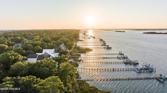 aerial view at dusk with a water view