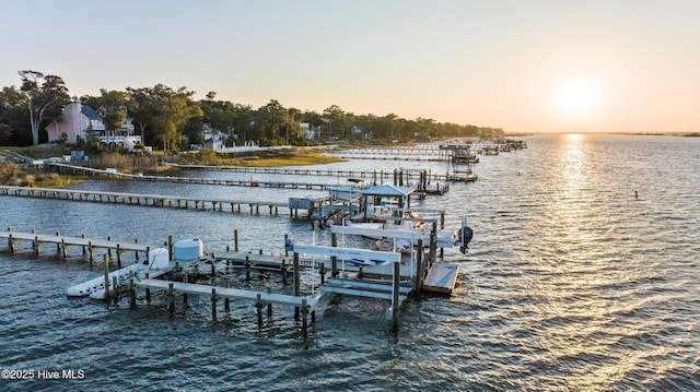 dock area with a water view and boat lift