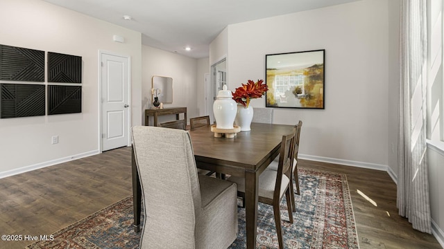 dining room with recessed lighting, wood finished floors, and baseboards