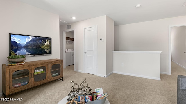 living room featuring visible vents, baseboards, washer and clothes dryer, carpet, and recessed lighting