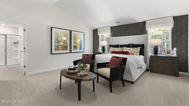 bedroom featuring light carpet, baseboards, and vaulted ceiling