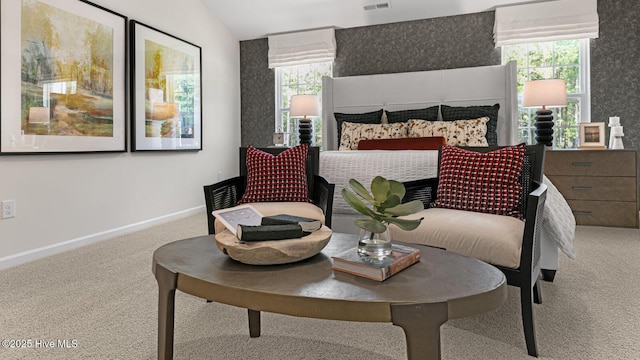 bedroom featuring carpet floors, multiple windows, vaulted ceiling, and baseboards