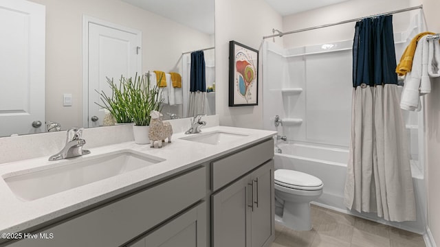 full bath with toilet, shower / tub combo, double vanity, and a sink