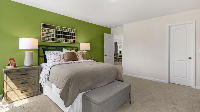 carpeted bedroom with baseboards