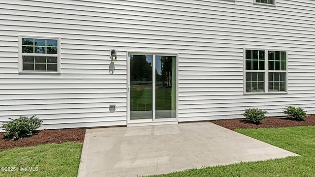 property entrance with a patio