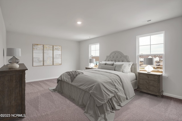 bedroom featuring visible vents, baseboards, and carpet flooring