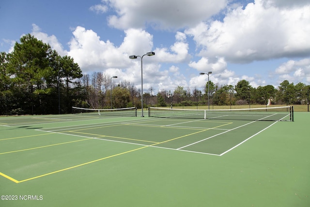 view of sport court with fence