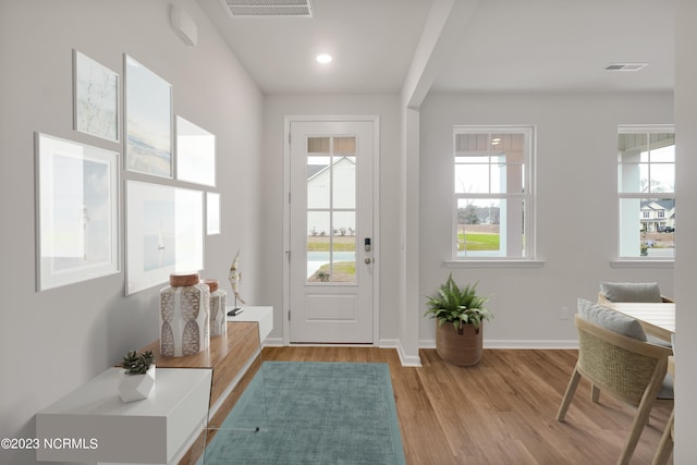 entryway with visible vents, recessed lighting, baseboards, and wood finished floors