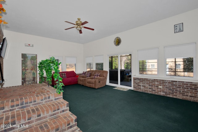 living room with carpet floors and a ceiling fan