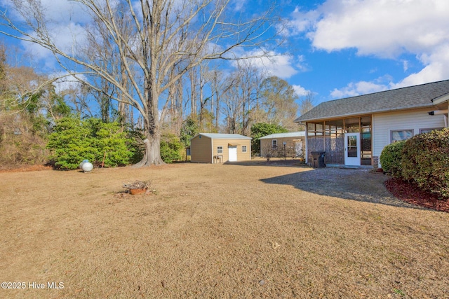 view of yard with an outdoor structure