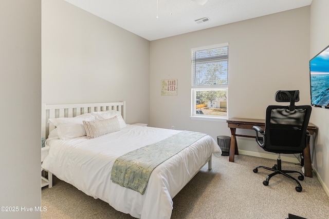 bedroom featuring carpet floors, baseboards, and visible vents