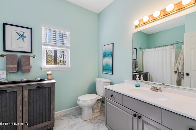 full bathroom featuring baseboards, toilet, marble finish floor, curtained shower, and vanity