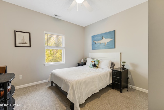 carpeted bedroom with visible vents, ceiling fan, and baseboards