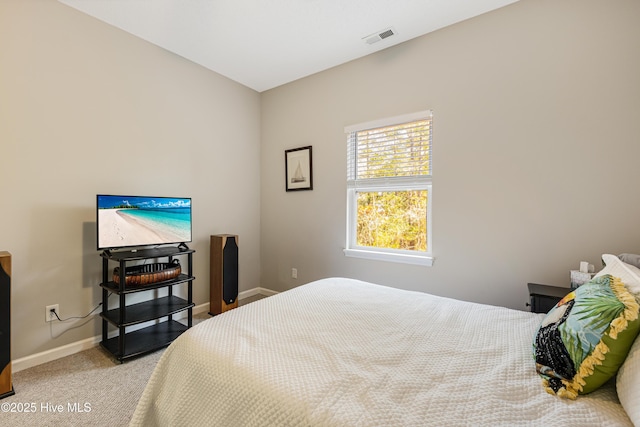 bedroom featuring light carpet, baseboards, and visible vents