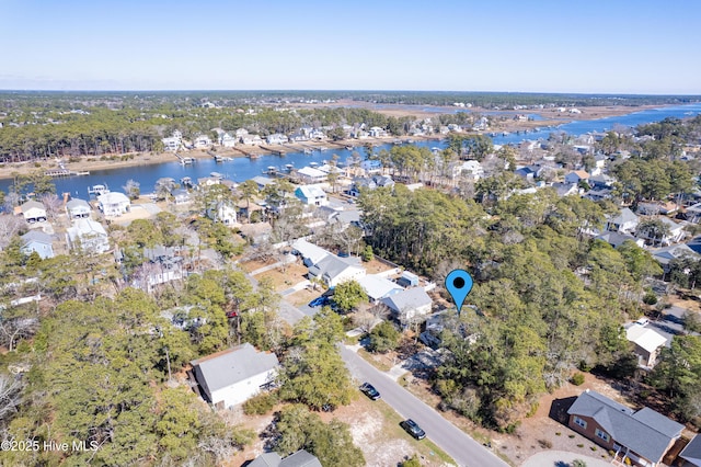 drone / aerial view featuring a residential view and a water view