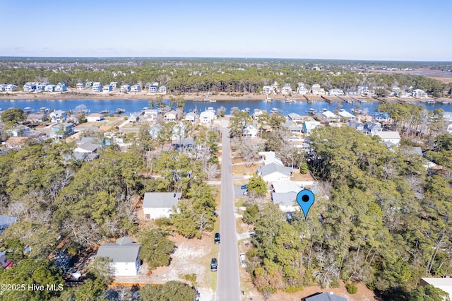 drone / aerial view featuring a water view and a residential view