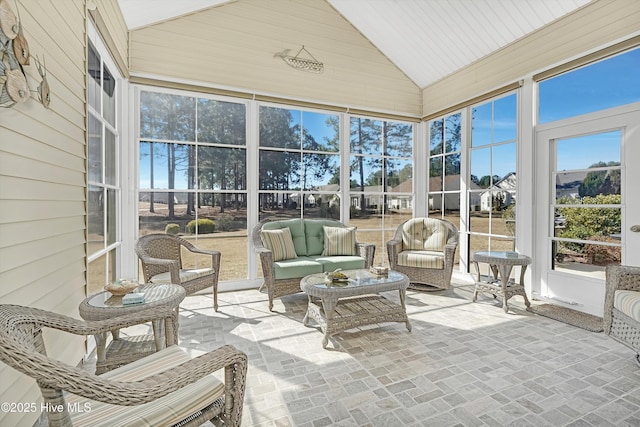 sunroom / solarium with vaulted ceiling