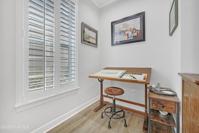 office area with baseboards and wood finished floors