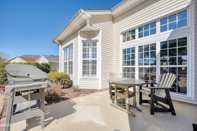 view of patio / terrace with outdoor dining space and grilling area