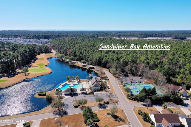 aerial view with a water view and a forest view