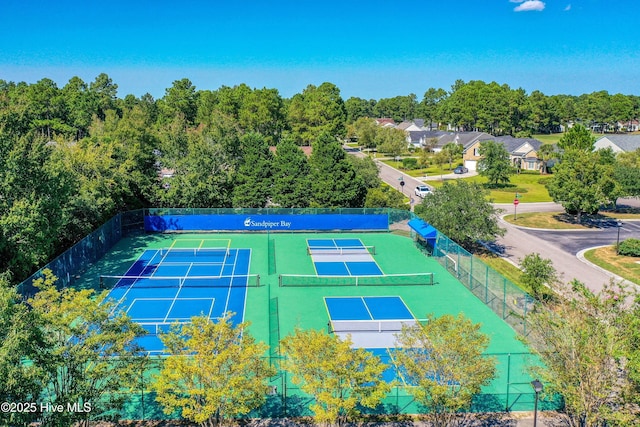 view of sport court featuring fence