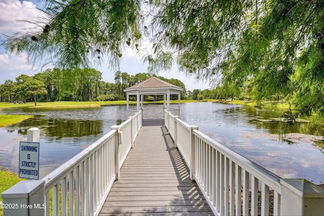 dock area with a gazebo and a water view