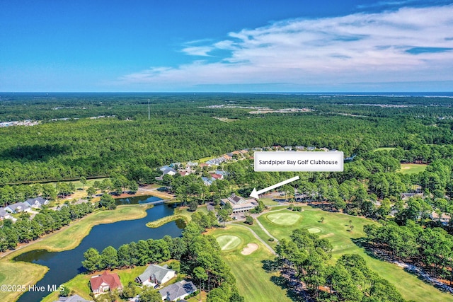 bird's eye view featuring a water view, view of golf course, and a view of trees