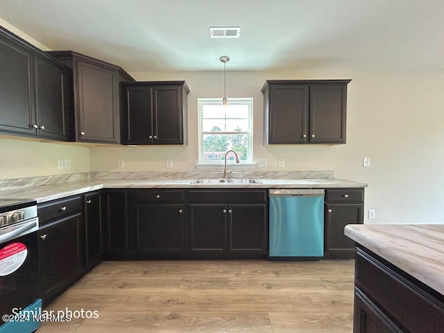 kitchen featuring visible vents, a sink, light wood-type flooring, dishwasher, and stainless steel electric range