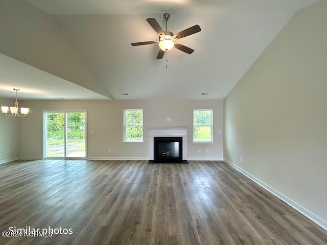 unfurnished living room with a fireplace with flush hearth, ceiling fan with notable chandelier, wood finished floors, and baseboards