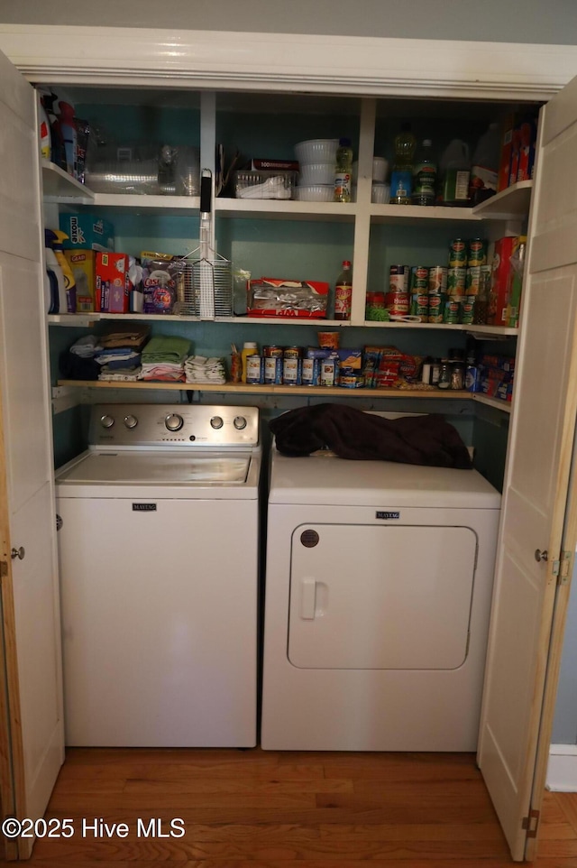 1426 Pocosin Rd, Winterville, NC 28590 - washroom featuring wood finished floors, separate washer and dryer, and laundry area