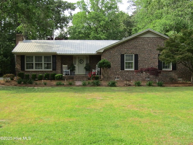 1426 Pocosin Rd, Winterville, NC 28590 - single story home with a porch, a front lawn, metal roof, a chimney, and brick siding