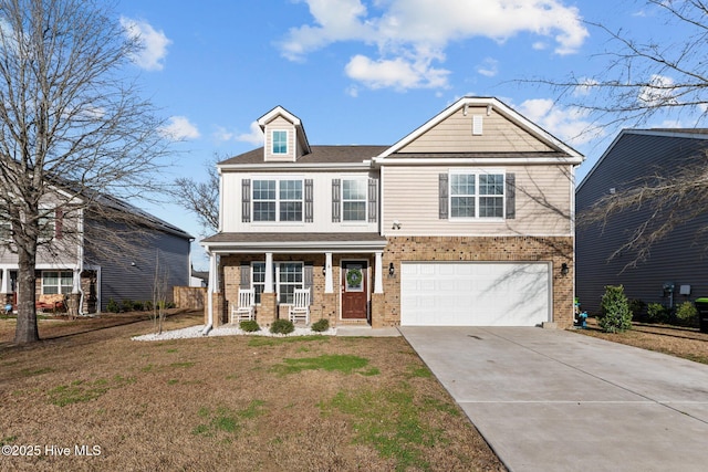 view of front of house with driveway, covered porch, an attached garage, and brick siding