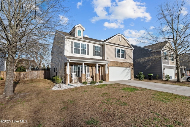 traditional-style house with driveway, a garage, fence, a porch, and brick siding