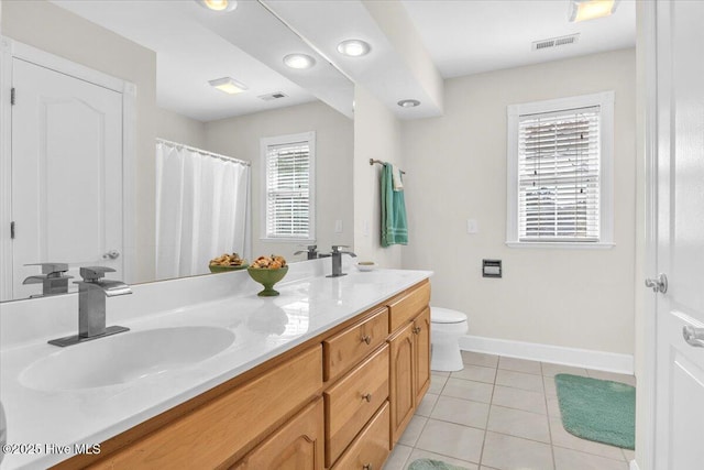 full bathroom with toilet, tile patterned flooring, a sink, and visible vents