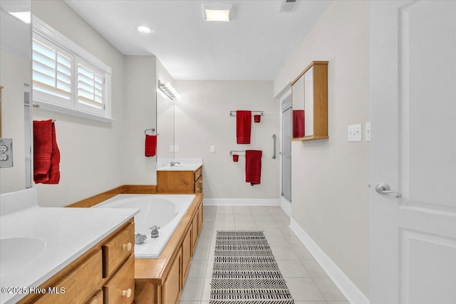 bathroom featuring two vanities, a stall shower, a sink, tile patterned flooring, and a bath