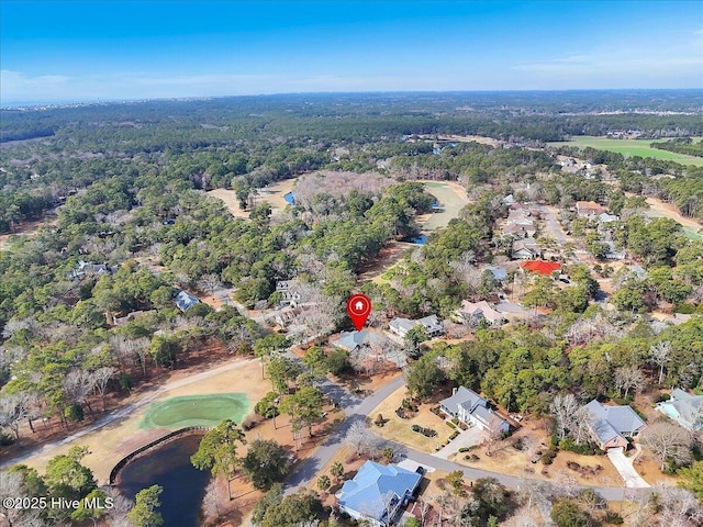 bird's eye view featuring a wooded view