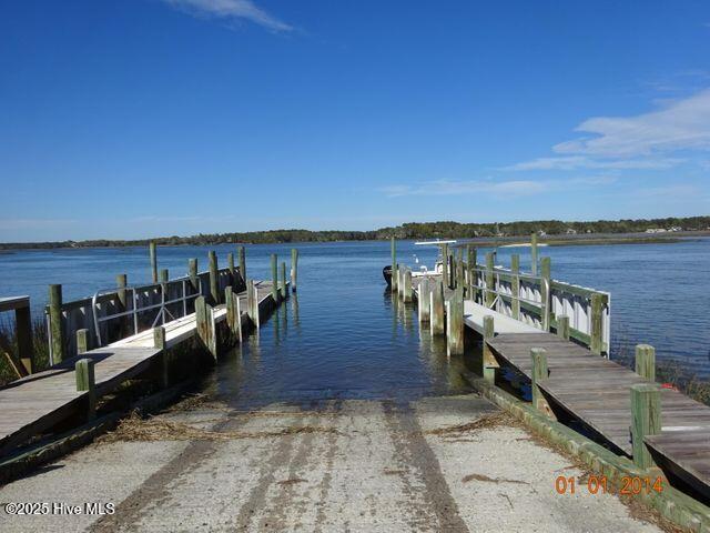 dock area featuring a water view