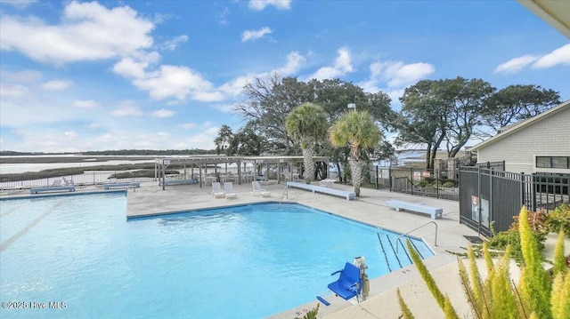 pool featuring a patio area and fence